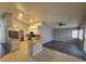 Bright, open kitchen with tile flooring, light cabinets, and modern fixtures at 5121 Backwoodsman Ave, Las Vegas, NV 89130