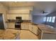 Well-equipped kitchen with granite countertops, stainless steel appliances, and ample storage at 5121 Backwoodsman Ave, Las Vegas, NV 89130