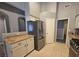 Functional kitchen with stainless steel refrigerator, granite counters, and classic white cabinetry at 5121 Backwoodsman Ave, Las Vegas, NV 89130