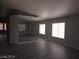 Bright living room featuring tile flooring and a large mirrored wall that enhances the space at 5121 Backwoodsman Ave, Las Vegas, NV 89130