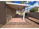 Spacious covered patio with desert landscaping and block wall at 5121 Backwoodsman Ave, Las Vegas, NV 89130