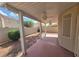 Covered patio area with desert landscaping and block wall at 5121 Backwoodsman Ave, Las Vegas, NV 89130