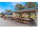 Shaded picnic area with multiple tables and a covered building at 5121 Backwoodsman Ave, Las Vegas, NV 89130