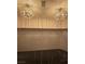 Walk-in closet featuring carpet, shelving, and two decorative chandeliers at 5121 Backwoodsman Ave, Las Vegas, NV 89130