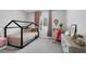 A room featuring a modern platform bed frame, dresser, and desert decor at 5234 Savannah Rose St, Las Vegas, NV 89149