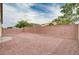 View of a backyard featuring decorative rock and a tall red brick wall, providing privacy at 525 Sun Mountain Ave, North Las Vegas, NV 89031