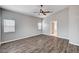 Bedroom with natural light, ceiling fan, and wood-look floors at 525 Sun Mountain Ave, North Las Vegas, NV 89031