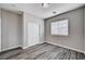 A bedroom with hard surface floors, closet and large window at 525 Sun Mountain Ave, North Las Vegas, NV 89031