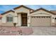 Inviting single-story home showcasing a well-manicured yard and a neutral color palette at 525 Sun Mountain Ave, North Las Vegas, NV 89031