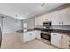 Open kitchen featuring granite countertops and stainless steel appliances at 525 Sun Mountain Ave, North Las Vegas, NV 89031