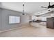 Open-concept floorplan with a kitchen featuring stainless steel appliances and ample counter space at 525 Sun Mountain Ave, North Las Vegas, NV 89031