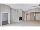 Spacious living room with tile floors, fireplace, and multiple entryways at 525 Sun Mountain Ave, North Las Vegas, NV 89031