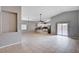 Open-concept with tile flooring and access to the kitchen and outdoor patio at 525 Sun Mountain Ave, North Las Vegas, NV 89031