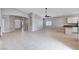 Expansive living room boasts tile floors, arched doorways, and a ceiling fan at 525 Sun Mountain Ave, North Las Vegas, NV 89031