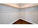 Walk-in closet featuring wood floors, white walls, and shelving at 525 Sun Mountain Ave, North Las Vegas, NV 89031