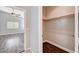 View of bedroom and walk-in closet with wood floor and wire shelves at 525 Sun Mountain Ave, North Las Vegas, NV 89031