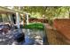 Serene backyard with a manicured lawn, stamped concrete patio, and lush landscaping at 5466 Fawn Chase Way, Las Vegas, NV 89135