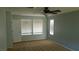 Comfortable bedroom with a ceiling fan, neutral paint, and ample natural light at 5466 Fawn Chase Way, Las Vegas, NV 89135