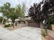 Inviting home with a wide driveway, stone accents, and a well-kept front yard at 5466 Fawn Chase Way, Las Vegas, NV 89135