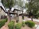 Charming two-story home with a well-maintained lawn and mature trees at 5466 Fawn Chase Way, Las Vegas, NV 89135