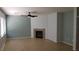 Cozy living room with a fireplace, neutral paint, and tile flooring at 5466 Fawn Chase Way, Las Vegas, NV 89135