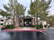 Community clubhouse featuring stone accents, mature landscaping, and ample parking at 555 E Silverado Ranch Blvd # 2030, Las Vegas, NV 89183