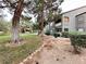 The exterior of the apartment building features lush landscaping at 555 E Silverado Ranch Blvd # 2030, Las Vegas, NV 89183