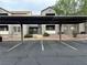 Condominium exterior featuring stucco facade and covered parking at 555 E Silverado Ranch Blvd # 2030, Las Vegas, NV 89183