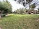 Apartment complex exterior with green lawns and mature trees at 555 E Silverado Ranch Blvd # 2030, Las Vegas, NV 89183