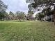 A grassy field and mature trees surround the apartments at 555 E Silverado Ranch Blvd # 2030, Las Vegas, NV 89183
