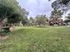 A grassy area with mature trees between apartment buildings at 555 E Silverado Ranch Blvd # 2030, Las Vegas, NV 89183