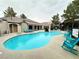 Community pool and sundeck surrounded by chairs at 555 E Silverado Ranch Blvd # 2030, Las Vegas, NV 89183