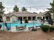 Community pool with table and chairs at 555 E Silverado Ranch Blvd # 2030, Las Vegas, NV 89183