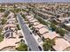 Scenic aerial view showcasing a residential neighborhood with lush landscaping, pools, and well-kept homes in a vibrant community at 5620 Siena Rose St, North Las Vegas, NV 89031
