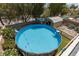 Aerial view of an above-ground pool with basketball hoop and backyard play structure at 5620 Siena Rose St, North Las Vegas, NV 89031