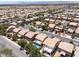 Panoramic aerial view of a neighborhood with homes, landscaping, and nearby streets at 5620 Siena Rose St, North Las Vegas, NV 89031