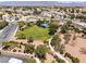 Community aerial view showing landscaped park with gazebo and walking paths in a residential neighborhood at 5620 Siena Rose St, North Las Vegas, NV 89031