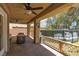An outdoor covered patio with an above ground pool visible in the background at 5620 Siena Rose St, North Las Vegas, NV 89031