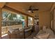 Covered patio with comfortable seating and an above-ground pool visible at 5620 Siena Rose St, North Las Vegas, NV 89031