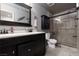Modern bathroom features a glass shower, updated vanity, and neutral paint at 5620 Siena Rose St, North Las Vegas, NV 89031