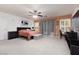 Spacious bedroom with a ceiling fan and plenty of natural light at 5620 Siena Rose St, North Las Vegas, NV 89031