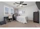 Inviting bedroom with ceiling fan and plenty of natural light at 5620 Siena Rose St, North Las Vegas, NV 89031