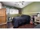 Cozy bedroom with wood-look floors at 5620 Siena Rose St, North Las Vegas, NV 89031