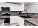 Well-lit kitchen features stainless steel appliances and stylish backsplash at 5620 Siena Rose St, North Las Vegas, NV 89031