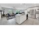 Modern open-concept kitchen with granite counters, stainless appliances, and a center island at 6619 Frosted Harvest Ave, Las Vegas, NV 89108