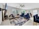 A contemporary living room features stylish blue accents, plush seating, and modern decor at 6619 Frosted Harvest Ave, Las Vegas, NV 89108