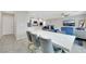 Bright, open floor plan integrates the modern kitchen and elegant dining area for seamless living at 6619 Frosted Harvest Ave, Las Vegas, NV 89108