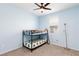Bright bedroom with a bunk bed, carpet floors, and a cute teddy bear at 668 Tiarella Ln, Henderson, NV 89015