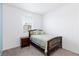 Inviting bedroom with a comfortable bed and natural light streaming through the window at 668 Tiarella Ln, Henderson, NV 89015