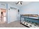 Cozy bedroom with a bunk bed and a ceiling fan, providing a comfortable space for rest and relaxation at 668 Tiarella Ln, Henderson, NV 89015